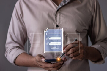 Young man with smartphone mobile hand using a pen touching to sign a Online Business Contract, Electronic signature, Contract signing, Digital documents, Future smart contract