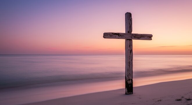 Wooden cross on beach at sunrise - Powered by Adobe