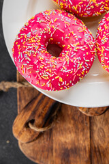 Donut sweet dessert fast food snack fresh delicious gourmet food background on the table rustic...