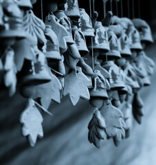 Artistic handmade clay hangers with a calm, cold-toned background and soft focus. A peaceful, serene scene ideal for meditation, mindfulness, zen, wellness, quotes, and copyspace for use.