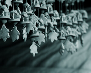 Artistic handmade clay hangers with a calm, cold-toned background and soft focus. A peaceful, serene scene ideal for meditation, mindfulness, zen, wellness, quotes, and copyspace for use.