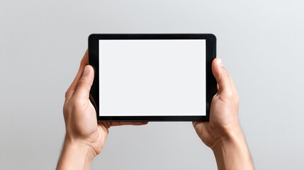 Professional Male Hand Holding Blank White Tablet Computer