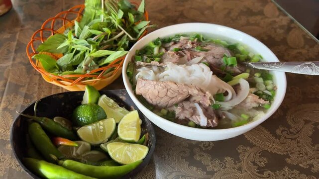 Soup pho bo serve buy phobo soup Pho Bo vietnamese Soup with beef and chopsticks in male hand cousine asian