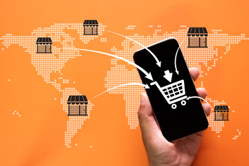 A hand holding a smartphone with a shopping cart icon and arrows pointing to various locations on a world map, showcasing the concept of global e-commerce, online shopping,digital marketplaces.