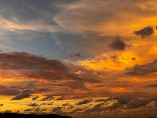 Vibrant sunset sky with dramatic clouds.