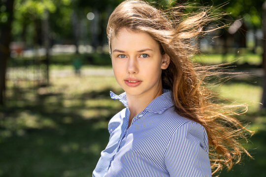 Portrait of a young tenager, summer park outdoors