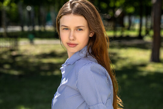 Portrait of a young tenager, summer park outdoors
