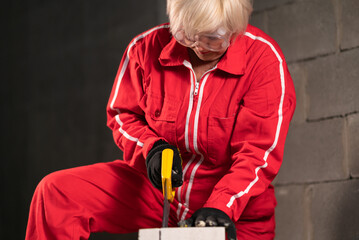 A worker cuts foam concrete blocks.