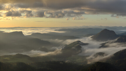 Majestic mountain peaks at sunrise, golden light through misty valleys -- A serene wilderness awakening