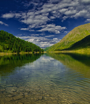 View on Obersee lake and mountains above Defereggental valley on a summer day
