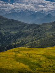 View on High Tauern / Hohen Tauren natural park from mountains near Saalbach Hinterglemm Leogang ski resort during summer day