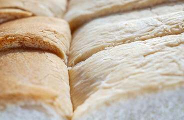 Fresh, soft and fragrant bread with brown edges macro food