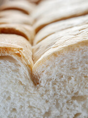 Fresh, soft and fragrant bread with brown edges macro food