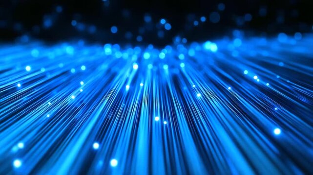 A close-up of individual strands of glowing nanofiber cable converging at a central processing hub, representing the core of high-speed digital connectivity.