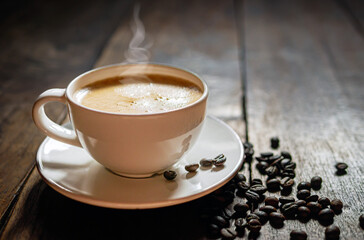 Coffee cup and coffee beans on wooden table, Espresso Crema coffee cup aromatic