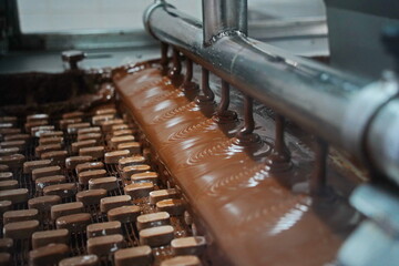 The candies are filled with a large layer of chocolate. Factory.