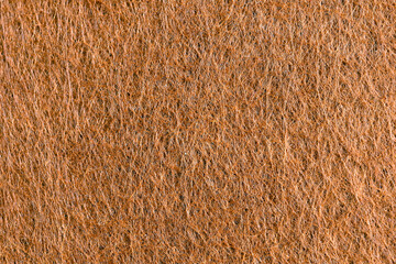 Close-up of brown felt. Textured pattern.