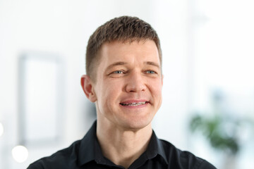 Portrait of handsome middle aged man indoors