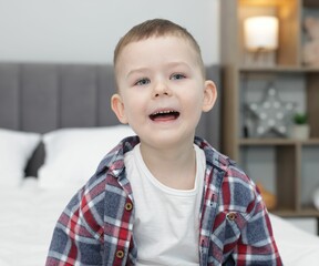 Portrait of cute little boy at home