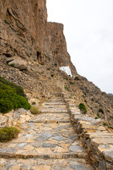 Stone steps that lead to the Hozoviotissa Monastery. Amorgos island. Cyclades, Greece