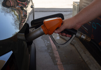 Refueling a Car at Gas Station