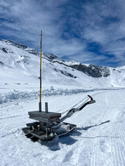 Classic track setter, the extension for ski track makers used to prepare tracks for classic cross-country skiing. Preparing a cross-country skiing trail in the Swiss Alps. Snow grooming equipment.
