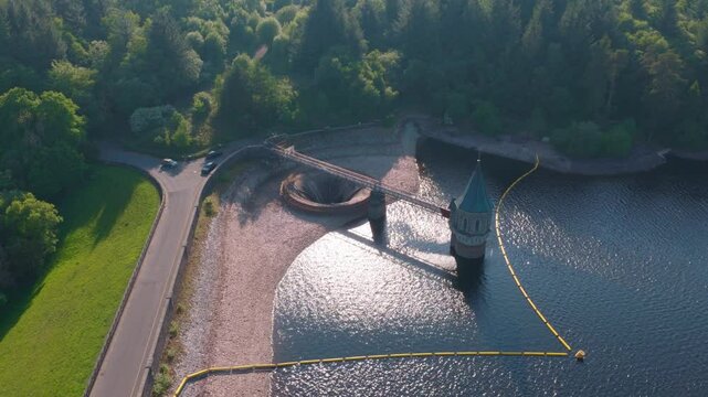 4k Aerial footage of Pontsticill Reservoir spillway plug hole Wales Uk. beautiful welsh landscape
