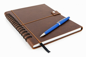 A closed notebook with a pen on top, perfect for writing notes or journaling