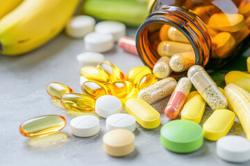 Healthy vitamin supplements, bananas, and dietary pills create vibrant scene of nutrition and wellness