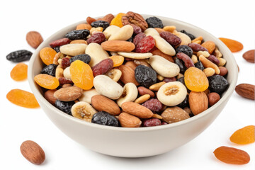 A white bowl filled with a mix of nuts and dried fruit, perfect for snacking or as a decorative centerpiece