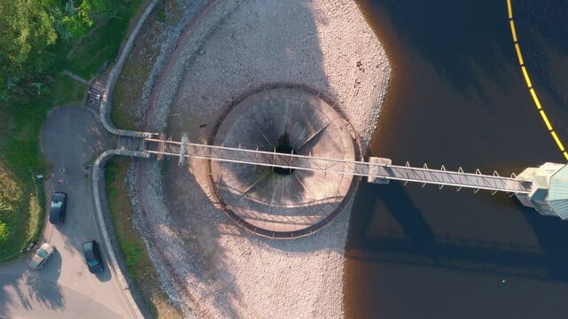 4k Aerial footage of Pontsticill Reservoir spillway plug hole Wales Uk. beautiful welsh landscape