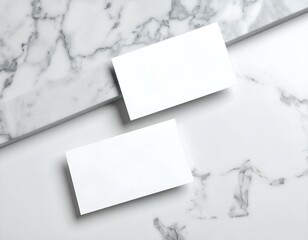 Two blank business cards on a marble background. Perfect for branding, marketing, and design mockups. Elegant and minimalist aesthetic.