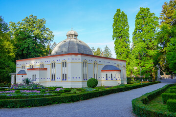 Bathhouse in a decorated park in Daruvar, Croatia. White building with a dome. 