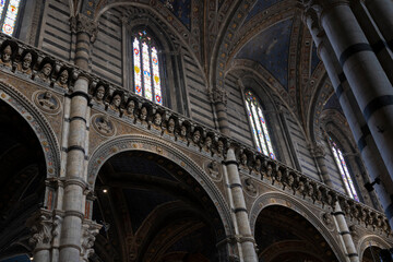 The interior of the Siena Cathedral (Duomo di Siena) with busts of popes and emperors. Italy.