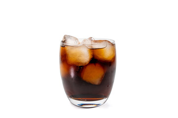 Glass with soda and ice cubes on white background. Glass with sparkling cola and ice cubes is refreshing. The cold is visible through the fogged glass - perfect for hot days.