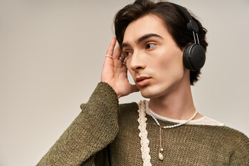 Young non-binary individual expresses fashion sense in a cozy indoor setting