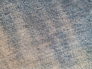 Background of denim fabric texture with faded color effect made of cotton. Surface of the denim...