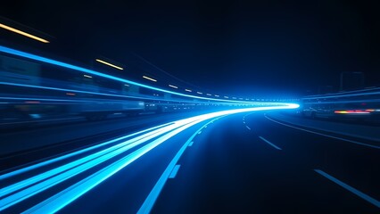 Obraz premium Electric blue light trails streak across a dark abstract backdrop, creating a dynamic, futuristic highway effect.