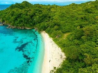 sea, sun and sand. Beach with palm trees with blue water, white sand. Summer holiday vibes. Beaches in Asia. 
