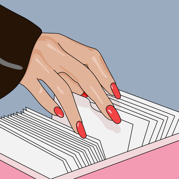 Close up of a Woman's Hand Searching for Documents in a Filing Cabinet