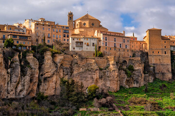Fototapeta premium Cuenca, Castile La Mancha, Spain. Houses hanging on a cliff edge in the old town of Cuenca. Travel and Tourism in Europe 