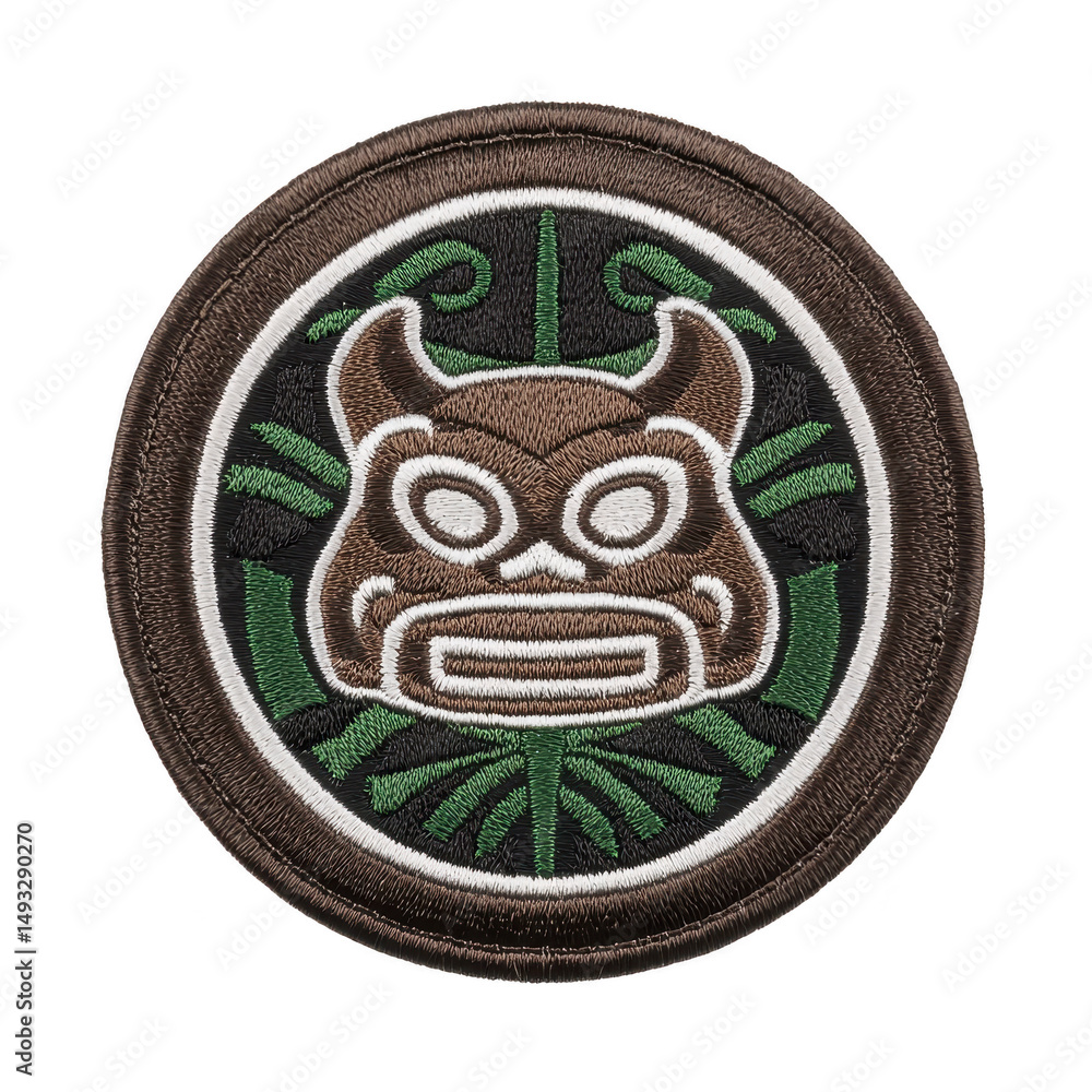 Poster round embroidered patch features stylized mask design with horns, set against background of green tr