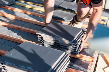 Craftsman roofer builds new house roof from ceramic tiles