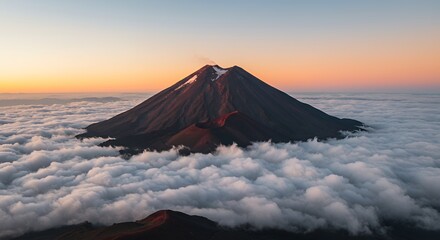 Volcano above Clouds at Sunset