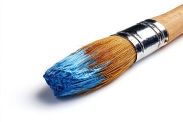 Fototapeta premium Close-up of a paintbrush with blue paint on its bristles against a white background. The image is crisp and clean, highlighting the texture and color of the brush.