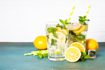 Lemonade in glass on white table.