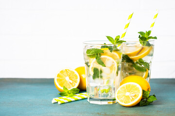 Lemonade in glass on white table.