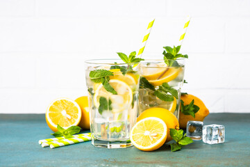 Lemonade in glass on white table.