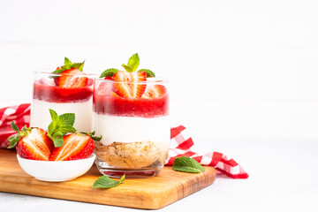 Strawberry cheesecake in glass, healthy dessert.