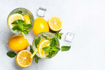 Lemonade in glass on white table.
